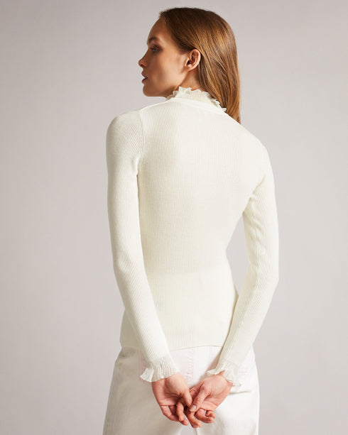 DVANA-Knitwear-For a frilling addition to your smart-casual wardrobe, add DVANA to your style repertoire. Not any ordinary knit, this ribbed jumper is given a little extra in the form of a frill detailing on the neckline and sleeves. Fitted jumper Cashmere blend High neck Long sleeves Frilled trims Ribbed knit- Ted Baker Romania